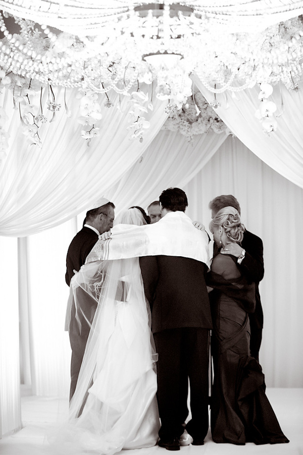 the bride and groom during ceremony rituals -photo by Houston based wedding photographer Adam Nyholt
